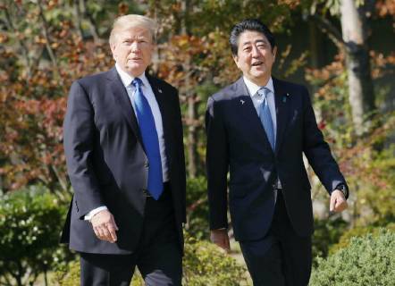 Trump in Japan Japanese Prime Minister Shinzo Abe (R) and U.S. President Donald Trump head for a working lunch at the Akasaka Palace state guesthouse in Tokyo on Nov. 6, 2017. The leaders agreed to step up pressure on North Korea over its nuclear and ballistic missile programs. (Pool photo)