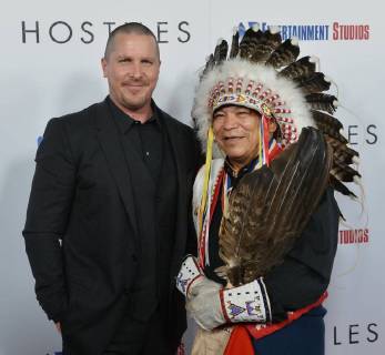 Cast member Christian Bale and Chief Phillip Whiteman Jr.attend the premiere of the motion picture western Hostiles at the Academy of Motion Picture Arts & Sciences in Beverly Hills, California on December 14, 2017. Storyline: In 1892, a legendary Army captain reluctantly agrees to escort a Cheyenne chief and his family through dangerous territory.  LAP2017121407 JIMxRUYMEN