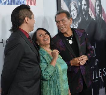 Cast member Wes Studi (R) and his wife Maura Dhu Studi and son Kholan Studi attend the premiere of the motion picture western Hostiles at the Academy of Motion Picture Arts & Sciences in Beverly Hills, California on December 14, 2017. Storyline: In 1892, a legendary Army captain reluctantly agrees to escort a Cheyenne chief and his family through dangerous territory.  LAP2017121422 JIMxRUYMEN