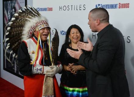 Cast member Christian Bale greets Chief Phillip Whiteman Jr. and his wife Lunette Two Bulls as they arrive for the premiere of the motion picture western Hostiles at the Academy of Motion Picture Arts & Sciences in Beverly Hills, California on December 14, 2017. Storyline: In 1892, a legendary Army captain reluctantly agrees to escort a Cheyenne chief and his family through dangerous territory.  LAP2017121426 JIMxRUYMEN