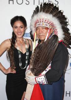 BEVERLY HILLS, CA - DECEMBER 14: Q Orianka Kilvcher, Chief Phillip Whiteman Jr., at Premiere Of Entertainment Studios Motion Pictures Hostiles at Samuel Goldwyn Theater, In Beverly Hills, California on December 14, 2017. Copyright: xFayexSadoux