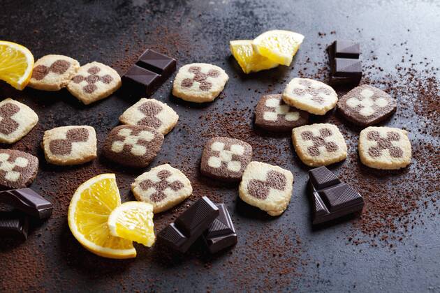 Black and white short crust Christmas cookies with orange slices and dark chocolate  CSF28499