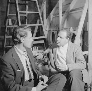 Theatre and film director Peter Brook at Elstree Studios in 1955 with actor Paul Scofield during production of Heaven and Earth, a made for TV drama co scripted by Brook and Denis Cannan and based on Jonah and the Whale., United Kingdom England Copyright: Topfoto  UnitedArchives1373167