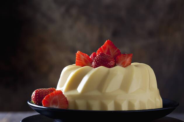 Custard with strawberries on plate  CSF28554