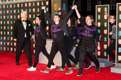 February 18, 2018 - London, London, UK - Demonstrators protest on the red carpet for the EE British Academy Film Awards 2018, held at the Royal Albert Hall, London, UK. London UK  - ZUMAl94_ 20180218_zaf_l94_065 Copyright: xRayxTangx