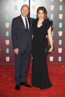 English actor Patrick Stewart and American singer Sunny Ozell attend The British Academy Film Awards (BAFTA) at the Royal Albert Hall in London on February 18, 2018.  LON20180218201 PAULxTREADWAY