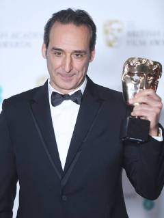 French composer Alexandre Desplat attends the Winners Room at the British Academy Film Awards at the Royal Albert Hall in London on February 18, 2018.  LON20180218143 RUNExHELLESTAD
