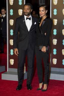 February 18, 2018 - London, London, UK - Chiwetel Ejiofor and Frances Aaternir arrives on the red carpet for the EE British Academy Film Awards 2018, held at the Royal Albert Hall. London UK  - ZUMAt138 20180218_zap_t138_119 Copyright: xRayxTangx