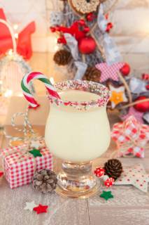 Eggnog with candy cane with colourful decoration for Christmas egg Nog with candy canes  1079704647