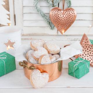 Butter cookies with powdered sugar heart-shaped Christmas Christmas cookies  1079704589