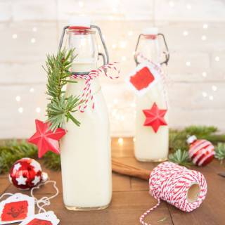 Bottle of eggnog with colourful decoration for Christmas homemade egg nog  1079704659