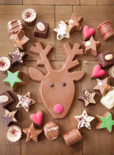 Various chocolate for Christmas on a background of wood Christmas chocolates  1079704698