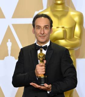 Composer Alexandre Desplat, winner of the award for Best Original Score award for The Shape of Water, appears backstage with his Oscar during the 90th annual Academy Awards at Loews Hollywood Hotel in the Hollywood section of Los Angeles on March 4, 2018.  LAP201803041071 JIMxRUYMEN