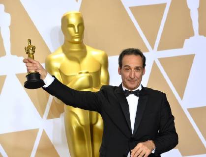 Composer Alexandre Desplat, winner of the award for Best Original Score award for The Shape of Water, appears backstage with his Oscar during the 90th annual Academy Awards at Loews Hollywood Hotel in the Hollywood section of Los Angeles on March 4, 2018.  LAP201803041074 JIMxRUYMEN