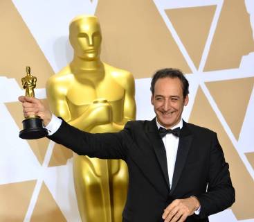Composer Alexandre Desplat, winner of the award for Best Original Score award for The Shape of Water, appears backstage with his Oscar during the 90th annual Academy Awards at Loews Hollywood Hotel in the Hollywood section of Los Angeles on March 4, 2018.  LAP201803041075 JIMxRUYMEN