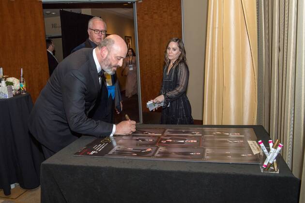 Mark Bridges signs a poster backstage with the Oscar for achievement in costume design for work on Phantom Thread during the live ABC Telecast of The 90th OscarsÂ® at the DolbyÂ® Theatre in Hollywood, CA on Sunday, March 4, 2018.  Copyright: xRobertxGladdenx 33546_540PLX