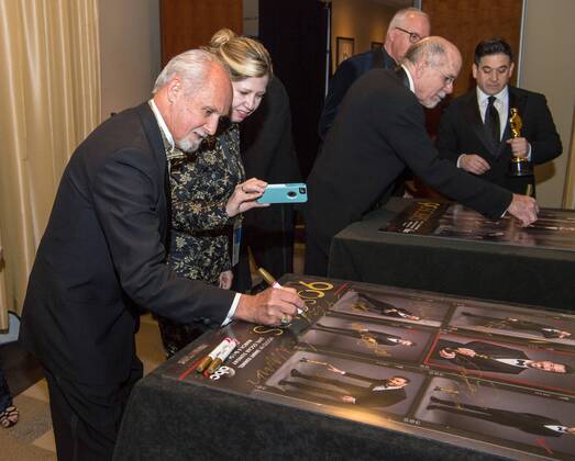 Gregg Landaker signs a poster backstage with the Oscar for achievement in sound mixing for work on Dunkirk during the live ABC Telecast of The 90th OscarsÂ® at the DolbyÂ® Theatre in Hollywood, CA on Sunday, March 4, 2018.  Copyright: xRobertxGladdenx 33546_541PLX