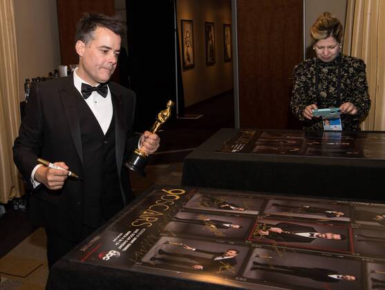 Sebastian Lelio signs posters backstage with the Oscar for best foreign language film for work on A Fantastic Woman from Chile during the live ABC Telecast of The 90th OscarsÂ® at the DolbyÂ® Theatre in Hollywood, CA on Sunday, March 4, 2018.  Copyright: xRobertxGladdenx 33546_544PLX