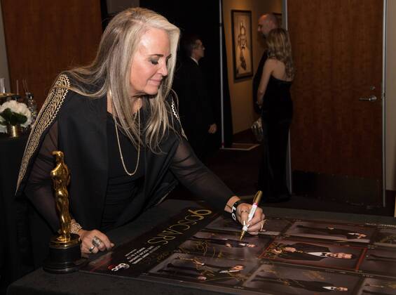 Darla K. Anderson signs posters backstage with the Oscar for best animated feature film for work on Coco during the live ABC Telecast of The 90th OscarsÂ® at the DolbyÂ® Theatre in Hollywood, CA on Sunday, March 4, 2018.  Copyright: xRobertxGladdenx 33546_547PLX