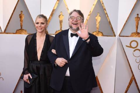 March 4, 2018 - Los Angeles, California, U.S. - GUILLERMO DEL TORO, right, who arrives with Screenwriter KIM MORGAN on the red carpet for the 90th Annual Academy Awards at the Dolby Theatre. Del Toro, won a Best Director Oscar for The Shape of Water. Los Angeles U.S. - ZUMAz03_ 20180304_zbp_z03_155 Copyright: xKevinxSullivanx