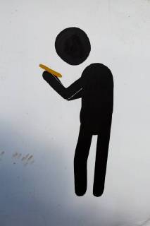 Pictogram figure looking at his smartphone against neutral digital background. Pictogram figure looking at his smartphone against neutral digital background  1083401320