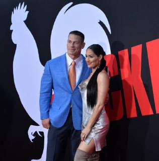 Cast member John Cena (L) and his wife, wrestler Nikki Bella attend the premiere of the motion picture comedy Blockers at the Regency Village Theatre in the Westwood section of Los Angeles on April3, 2018. Storyline: Three parents try to stop their daughters from having sex on Prom night.  LAP2018040352 JIMxRUYMEN