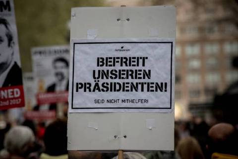 April 6, 2018 - Barcelona, Catalonia, Spain - In Barcelona streets people demonstrating for the release of imprisoned Catalan leaders carry a banner reading in German Free our president. Do not be accomplice . A German court has released former Catalan president Carles Puigdemont on bail and rejected the charge of rebellion. Puigdemont called for the immediate release of all imprisoned Catalan leaders as he left Neumunster prison. Barcelona Spain - ZUMAb137 20180406_zap_b137_007 Copyright: xJordixBoixareux