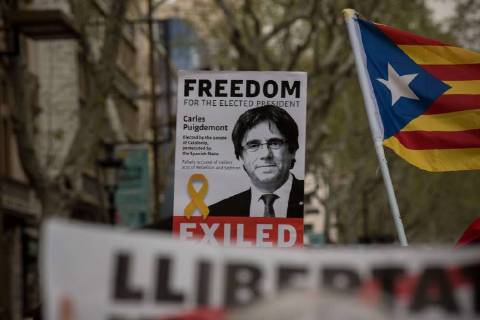 April 6, 2018 - Barcelona, Catalonia, Spain - In Barcelona streets people demonstrating for the release of imprisoned Catalan leaders carry banners of Carles Puigdemont. A German court has released former Catalan president Carles Puigdemont on bail and rejected the charge of rebellion. Puigdemont called for the immediate release of all imprisoned Catalan leaders as he left Neumunster prison. Barcelona Spain - ZUMAb137 20180406_zap_b137_001 Copyright: xJordixBoixareux
