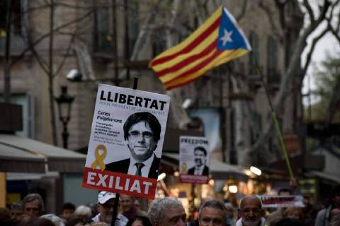 April 6, 2018 - Barcelona, Catalonia, Spain - In Barcelona streets people demonstrating for the release of imprisoned Catalan leaders carry banners of Carles Puigdemont. A German court has released former Catalan president Carles Puigdemont on bail and rejected the charge of rebellion. Puigdemont called for the immediate release of all imprisoned Catalan leaders as he left Neumunster prison. Barcelona Spain - ZUMAb137 20180406_zap_b137_006 Copyright: xJordixBoixareux