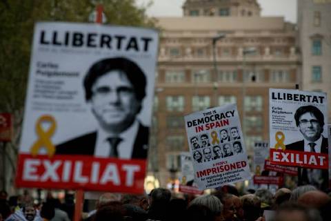 April 6, 2018 - Barcelona, Catalonia, Spain - In Barcelona streets people demonstrating for the release of imprisoned Catalan leaders carry banners of Carles Puigdemont. A German court has released former Catalan president Carles Puigdemontt on bail and rejected the charge of rebellion. Puigdemont called for the immediate release of all imprisoned Catalan leaders as he left Neumunster prison. Barcelona Spain - ZUMAb137 20180406_zap_b137_008 Copyright: xJordixBoixareux