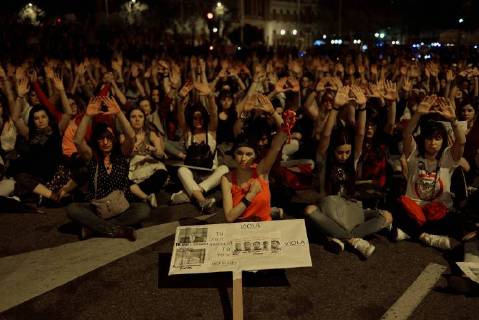 April 26, 2018 - Madrid, Spain - A protester holds a placard with pictures depicting the members of La Manada during a demonstration against the verdict of the La Manada (Wolf Pack) gang case outside the Minister of Justice on April 26, 2018 in Madrid, Spain. The High Court of Navarra has given a sentence of 9 years in prison to five men for continued sexual abuse instead of rape , which they would have recieved around 22 years in prison. The gang assaulted an 18-year-old woman in Pamplona, during the San Fermin Festival in 2016. Feminists and women s rights groups have called for demonstrations across Spain. Madrid Spain - ZUMAn230 20180426_zaa_n230_1167 Copyright: xJuanxCarlosxLucasx