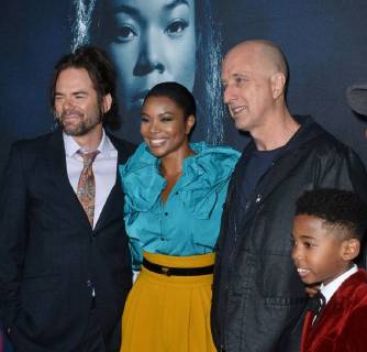 Cast members Billy Burke, Gabrielle Union and Seth Carr (L-R) join director James McTeigue (3rd-L) on the carpet for a photo-op during the special screening of the motion picture thriller Breaking In at the ArcLight Cinema Dome in the Hollywood section of Los Angeles on May 1, 2018. Storyline: A woman fights to protect her family during a home invasion.  LAP2018050129 JIMxRUYMEN