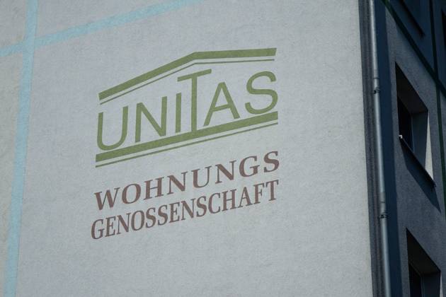 Advertisement of Unitas Wohnungsgenossenschaft Advertisement of Unitas Wohnungsgenossenschaft 29 04 2018 Leipzig Saxony On one of the facades of the house there is an advertisement for the Housing Cooperative Unitas eG