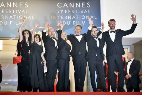 (180510) -- CANNES (FRANCE), May 10, 2018 -- Producer Tanya Seghatchian and Ewa Puszczynska, actor Borys Szyc, actress Joanna Kulig, director Pawel Pawlikowski, cinematographer Lukasz Zal, and actor Tomasz Kot (from L to R) of the film Cold War pose for photos during the premiere red carpet of Cold War at the 71st Cannes International Film Festival in Cannes, France, on May 10, 2018. The 71st Cannes International Film Festival is held from May 8 to May 19. ) FRANCE-CANNES-71ST INTERNATIONAL FILM FESTIVAL-COLD WAR-RED CARPET ChenxYichen