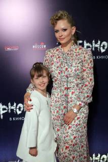 MOSCOW, RUSSIA â€“ MAY 17, 2018: Actress Yulia Peresild with her daughter Anna at the Moscow premiere of Sergei Mokritsky s fantasy film Chernovik A Rough Draft based on Russian science fiction writer Sergei Lukyanenko s novel of the same name, at the Karo 11 Oktyabr cinema. Sergei Bobylev TASS  TS07FE95