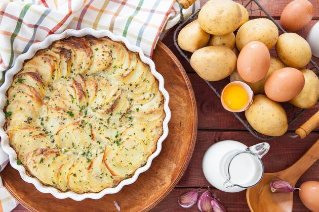 Homemade potato gratin in casserole dish with ingredients Homemade potato gratin  1079704950