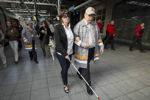 - BRUSSELS, BELGIUM: MR Minister of Mobility Jacqueline Galant pictured during the awareness activity Encounter in the dark , at Brussels Zuid-Midi railway station, Tuesday 29 September 2015. Ministers Galant and Sleurs are wearing opaque glasses to simulate a train journey of a blind. KRISTOFxVANxACCOM  x85756286x