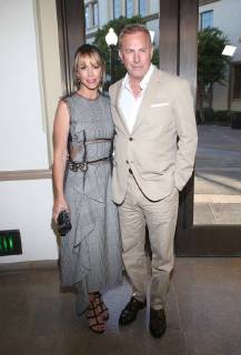LOS ANGELES, CA - JUNE 11:Christine Baumgartner and Kevin Costner at the premiere of Yellowstone at Paramount Studios in Los Angeles, California on June 11, 2018. Copyright: xFayexSadoux