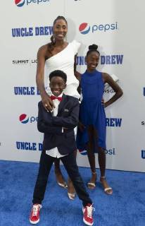 USA: Uncle Drew New York Premiere Lisa Leslie & children Michael Joseph Lockwood II, Lauren Jolie Lockwood attend the Uncle Drew New York Premiere at Alice Tully Hall Lincoln Center New York New York United States Alice Tully Hall Lincoln Center  LevxRadin