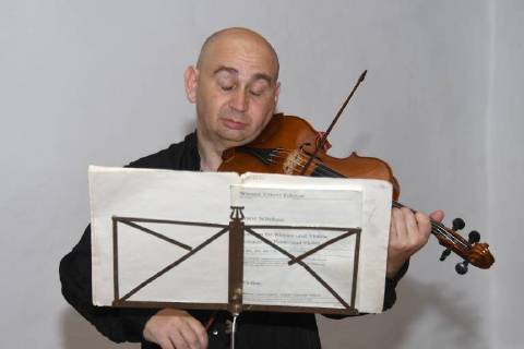 Violinist Ilja Korol practices in the Klostersaal Traunkirchen for his performance in the evening in front of an audience of Salzkammergut Festwochen Gmunden This picture shows the well-known international Russian violin specialist on the background of ancient music Ilja Korol For his musical achievements he was awarded Austrian citizenship