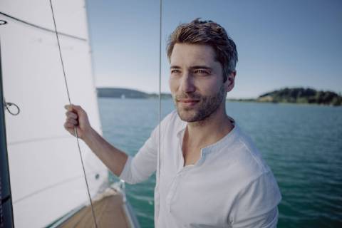 Portrait of a man on a sailing boat model released Symbolfoto  JLOF00070