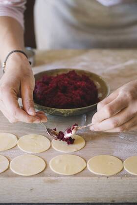 Woman preparing ravioli, beetroot sage filling model released Symbolfoto  ALBF00502