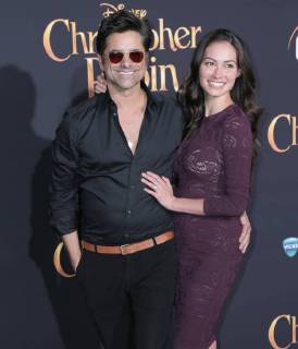 July 30, 2018 - U.S. - 30 July 2018 - Burbank, California - John Stamos, Caitlin McHugh. Premiere of Disney s Christopher Robin held at Walt Disney Studios. Photo Credit: PMA AdMedia U.S. - ZUMAa123 20180730_zaa_a123_254 Copyright: xPmax
