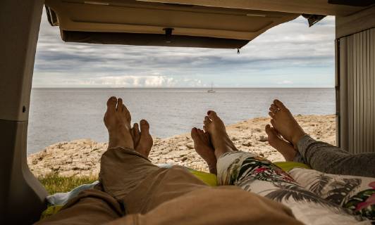 Pula THEME PICTURE Feet of a woman of a teenager and a man in a bed of a camper with an open tailgate with the panorama of the Adriatic taken on 28 June 2018 in Pula Croatia Feet of a woman with a teenage boy and a man in a bed with a open tailgate the panorama of the Adriatic Pula Croatia on 2018 06 28  EX_FEI