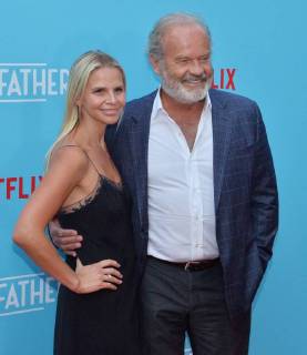 Cast member Kelsey Grammer and his wife Kayte Walsh attend the premiere of the motion picture comedy Like Father at the ArcLight Cinema Dome in the Hollywood section of Los Angeles on July 31, 2018. The storyline follows a workaholic woman who is left at the altar takes her honeymoon trip anyway with her overachieving father who left her mother because he believed his family was holding back his career.  LAP2018073131 JIMxRUYMEN