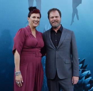 Cast member Rainn Wilson and his wife, American fiction writer Holiday Reinhorn attend the premiere of the sci-fi motion picture thriller The Meg at TCL Chinese Theatre in the Hollywood section of Los Angeles on August 6, 2018. Storyline: After escaping an attack by what he claims was a 70-foot shark, Jonas Taylor must confront his fears to save those trapped in a sunken submersible.  LAP2018080644 JIMxRUYMEN