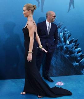 Cast member Jason Statham and his partner, English actress and model Rosie Huntington-Whiteley attend the premiere of the sci-fi motion picture thriller The Meg at TCL Chinese Theatre in the Hollywood section of Los Angeles on August 6, 2018. Storyline: After escaping an attack by what he claims was a 70-foot shark, Jonas Taylor must confront his fears to save those trapped in a sunken submersible.  LAP2018080622 JIMxRUYMEN