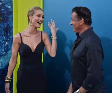 English actress and model Rosie Huntington-Whiteley and actor Sylvester Stallone mingle during the premiere of the sci-fi motion picture thriller The Meg at TCL Chinese Theatre in the Hollywood section of Los Angeles on August 6, 2018. Storyline: After escaping an attack by what he claims was a 70-foot shark, Jonas Taylor must confront his fears to save those trapped in a sunken submersible.  LAP2018080648 JIMxRUYMEN