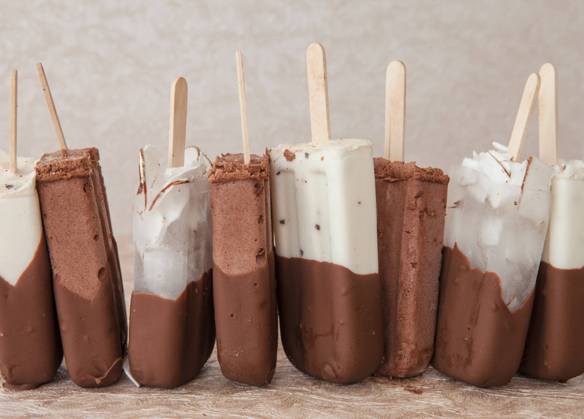 Popsicles with chocolate vanilla and coconut ice cream popsicles  1079705136