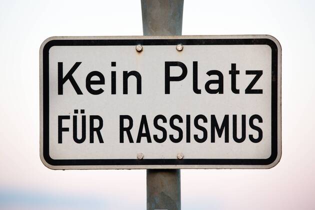 No place for racism sign with indication against racism No place for racism sign with indication against racism  1083401432